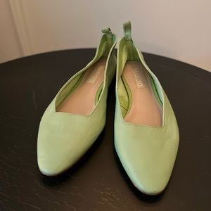 Mint green leather flats.